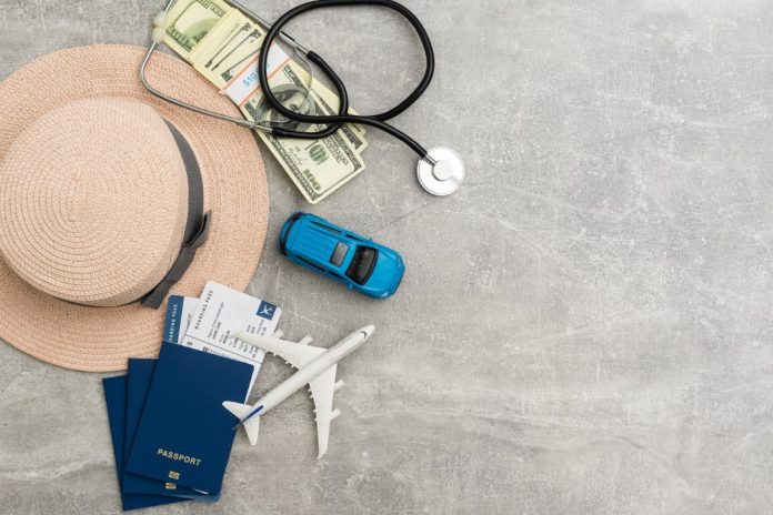 Airplane in flight with a medical mask. Concept - observance of safety on the plane. Traveling by air at social distance. Compliance with the recommendations of doctors on trips. Opening borders.
